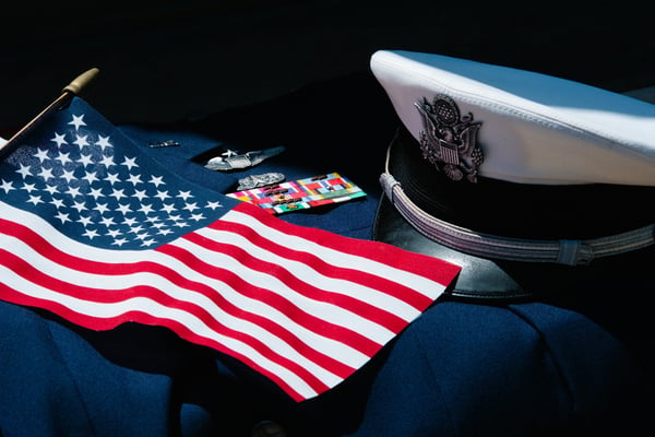 Navy uniform with American flag and officer's cap