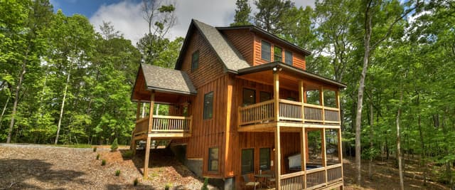 Cedar cabin in the woods with multi-level decks