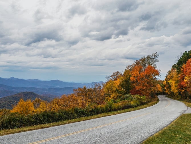 Winding Blue Ridge Parkway road through autumn fall color